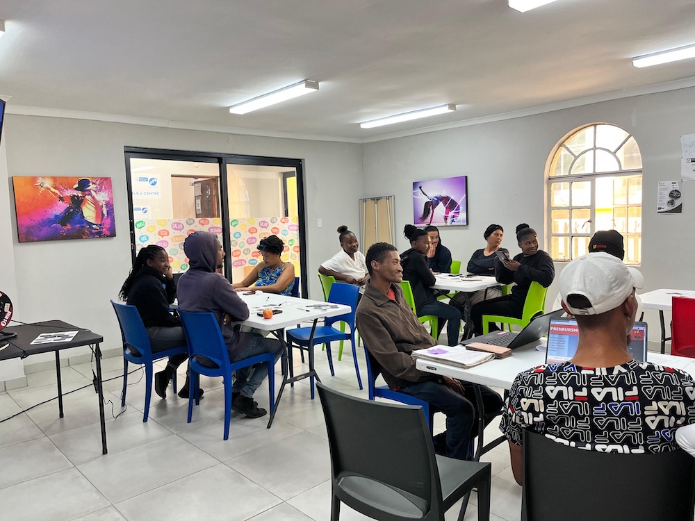 Youth engaging in activities at a cafe